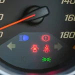 Car dashboard displaying warning lights