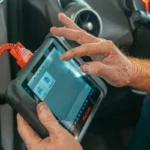 Vehicle diagnostic scanner connected to a car