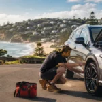 Mechanic inspecting a car near the Northern Beaches coast
