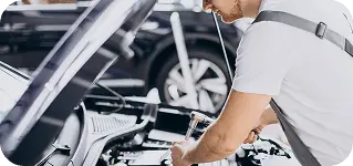 Mechanic doing a general repair under the hood