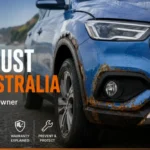 Blue MG SUV with visible rust around the wheel arch and front bumper in Australia